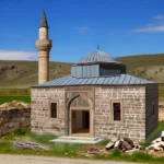 DALL·E 2024-03-27 15.58.57 - Create an image of a small, quaint Ottoman mosque, representing the Palu Small Mosque from the 16th century. It should feature intricate stone carving